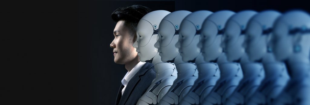 A row of humanoid robots with a human at the front.