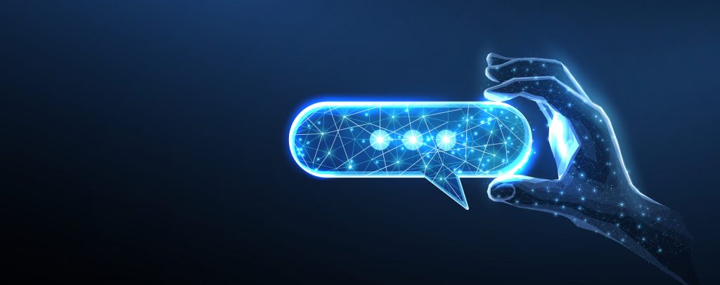 Digital speech bubble in digital hand.
